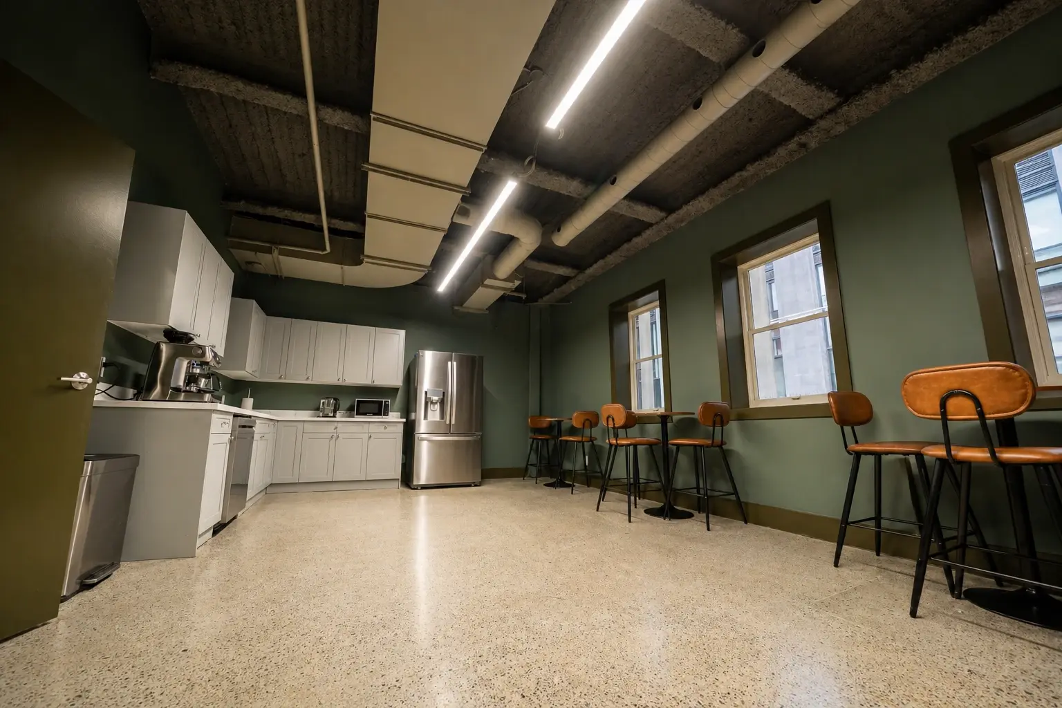Modern industrial break room with greenery 1