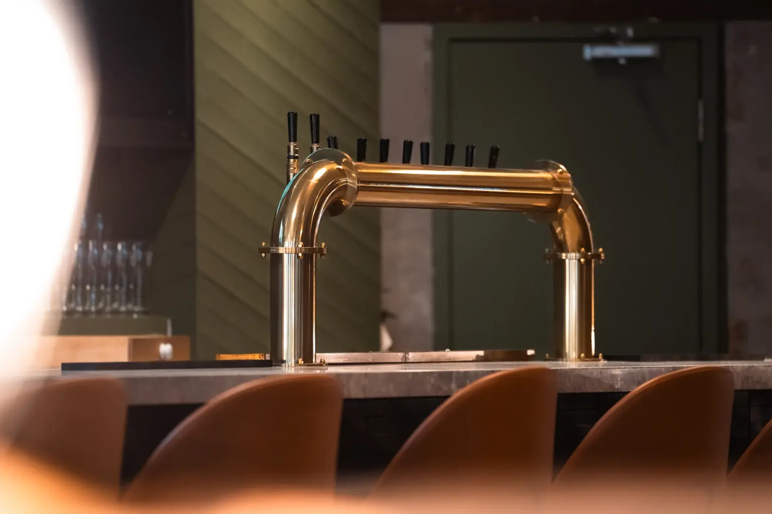 Close up of bar stools and beer taps